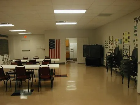 Tables and chairs set out inside the clubhouse