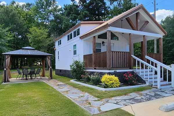Villa 100 seen from the front, with its covered porch and gazebo