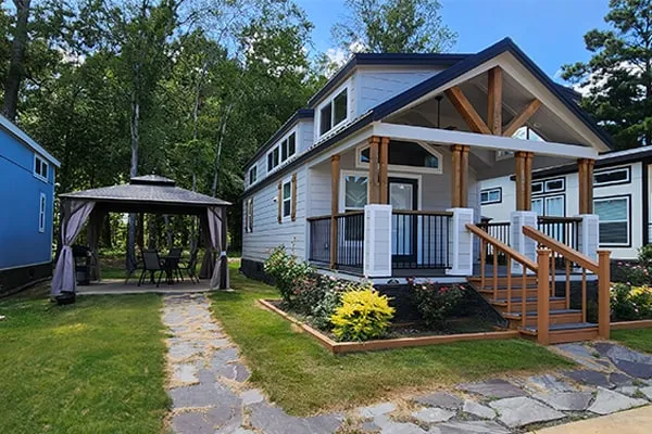 Villa 106 seen from the front, with its covered porch and gazebo