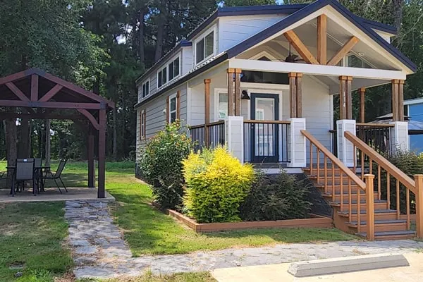 Villa 114 seen from the front, with its covered porch and gazebo